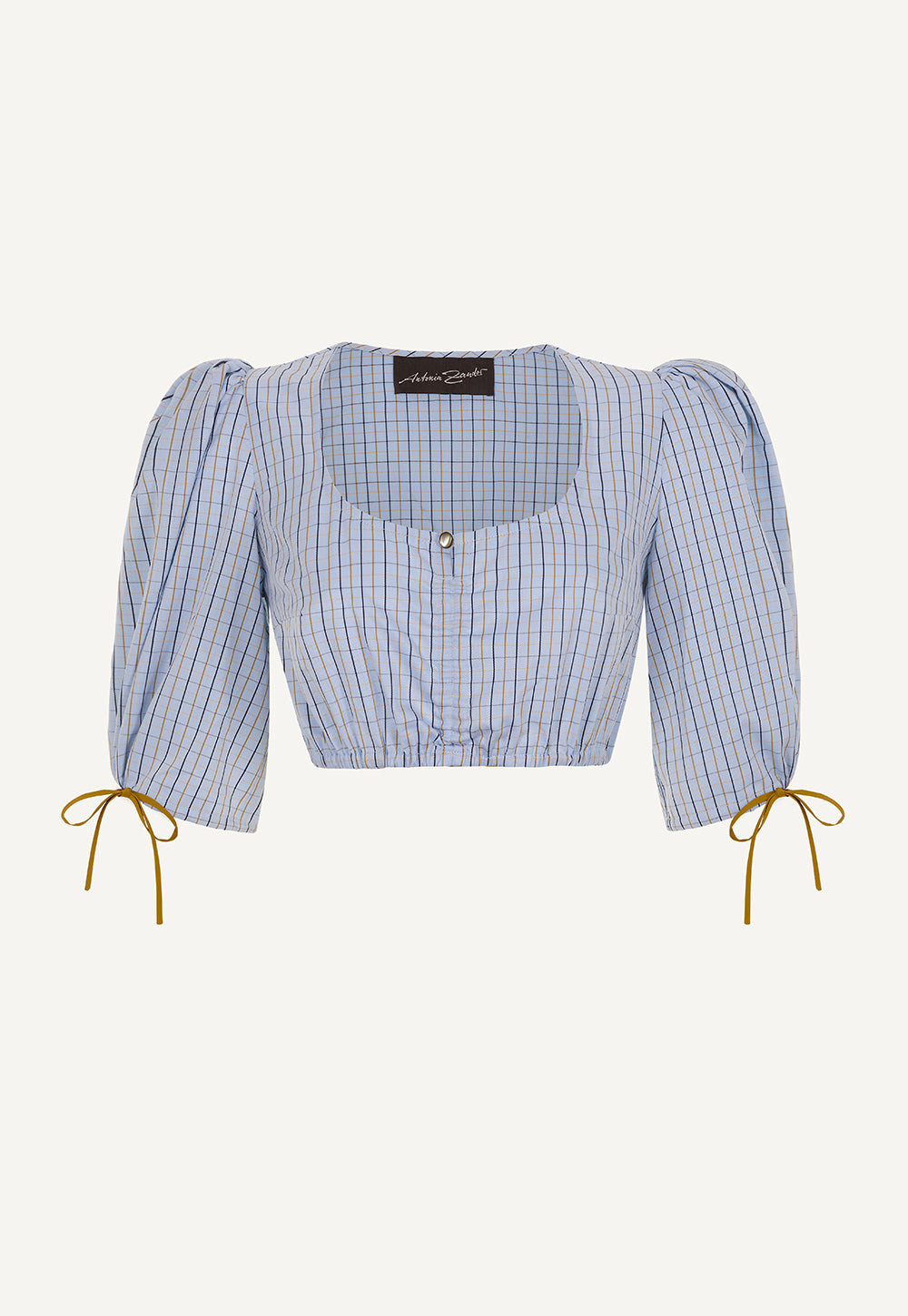 Resi Blouse Karo with a checked cotton fabric, square neckline, puff sleeves with adjustable ties and an elasticated hem.