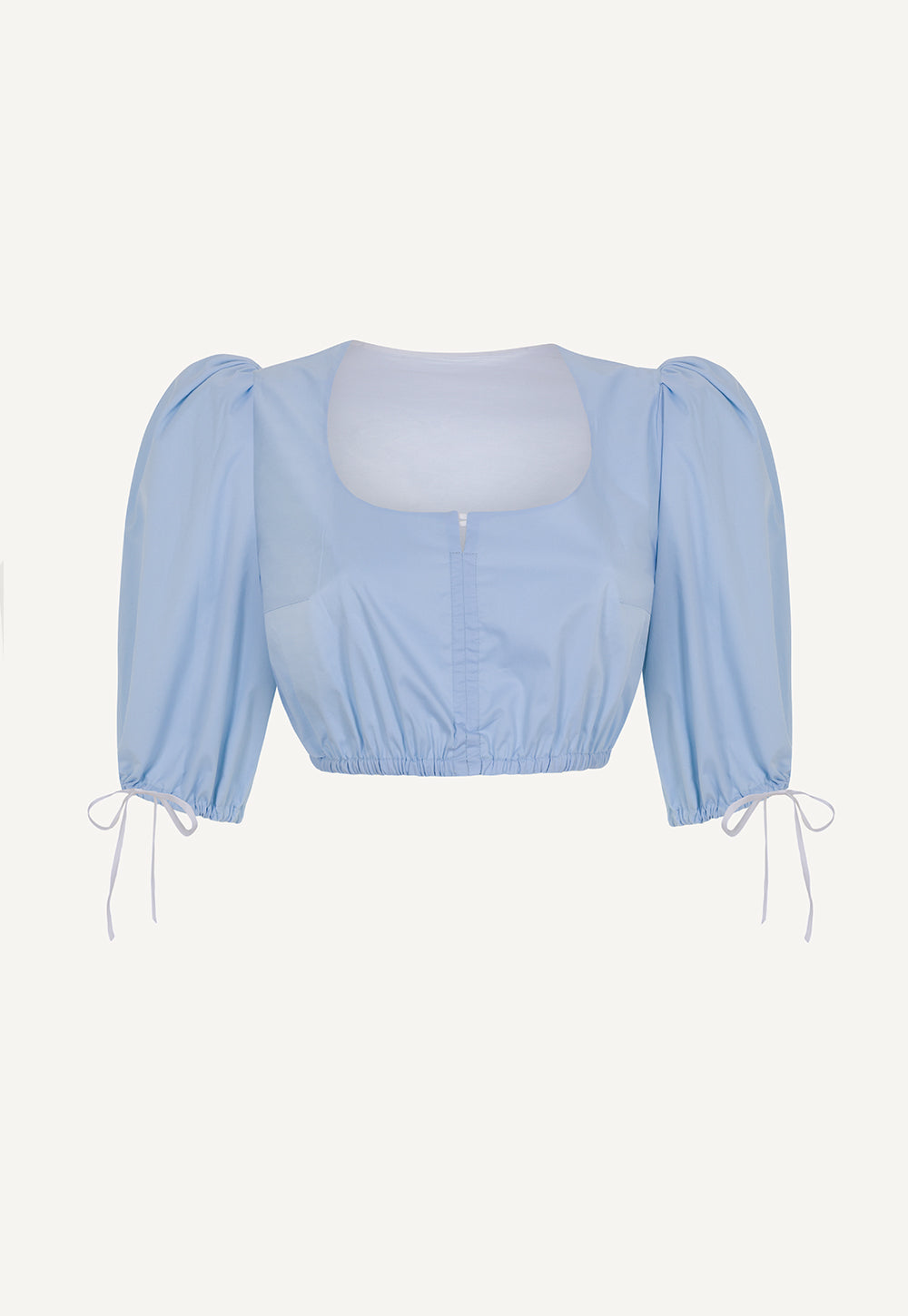 Back view of the Resi reversible dirndl blouse in white and light blue with voluminous sleeves.